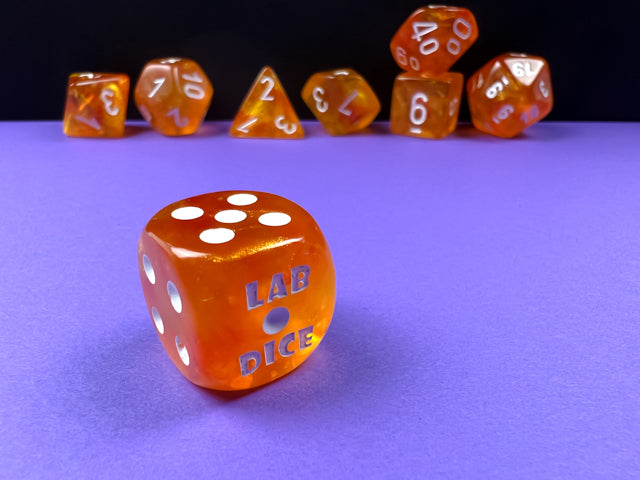 Borealis Polyhedral Blood Orange-White Luminary 7-Dice Set - Brain Spice